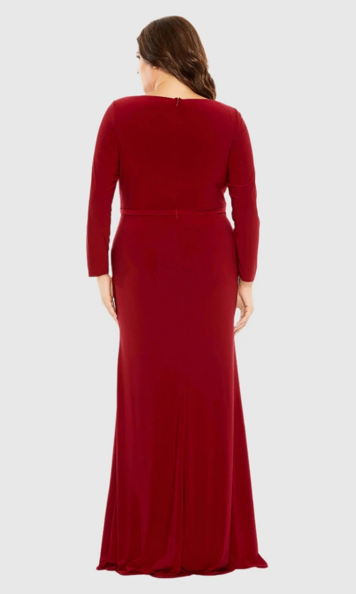 A woman is shown from the back wearing the Long Plus-Size Formal Dress 68442 by Mac Duggal, featuring long sleeves and a floor-length silhouette, against a plain light background.